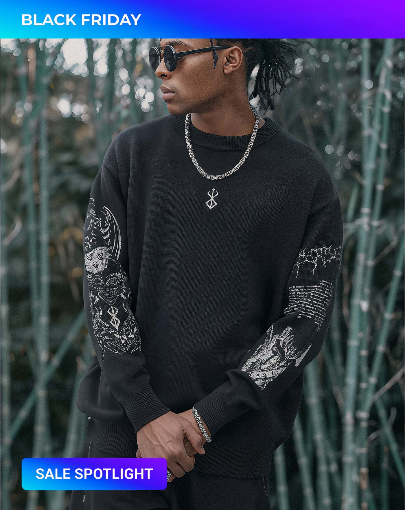 Man wearing a black anime-inspired streetwear sweatshirt featuring intricate sleeve graphics and a minimal front design, styled with chain and sunglasses from Torazen’s Dark Armor collection.