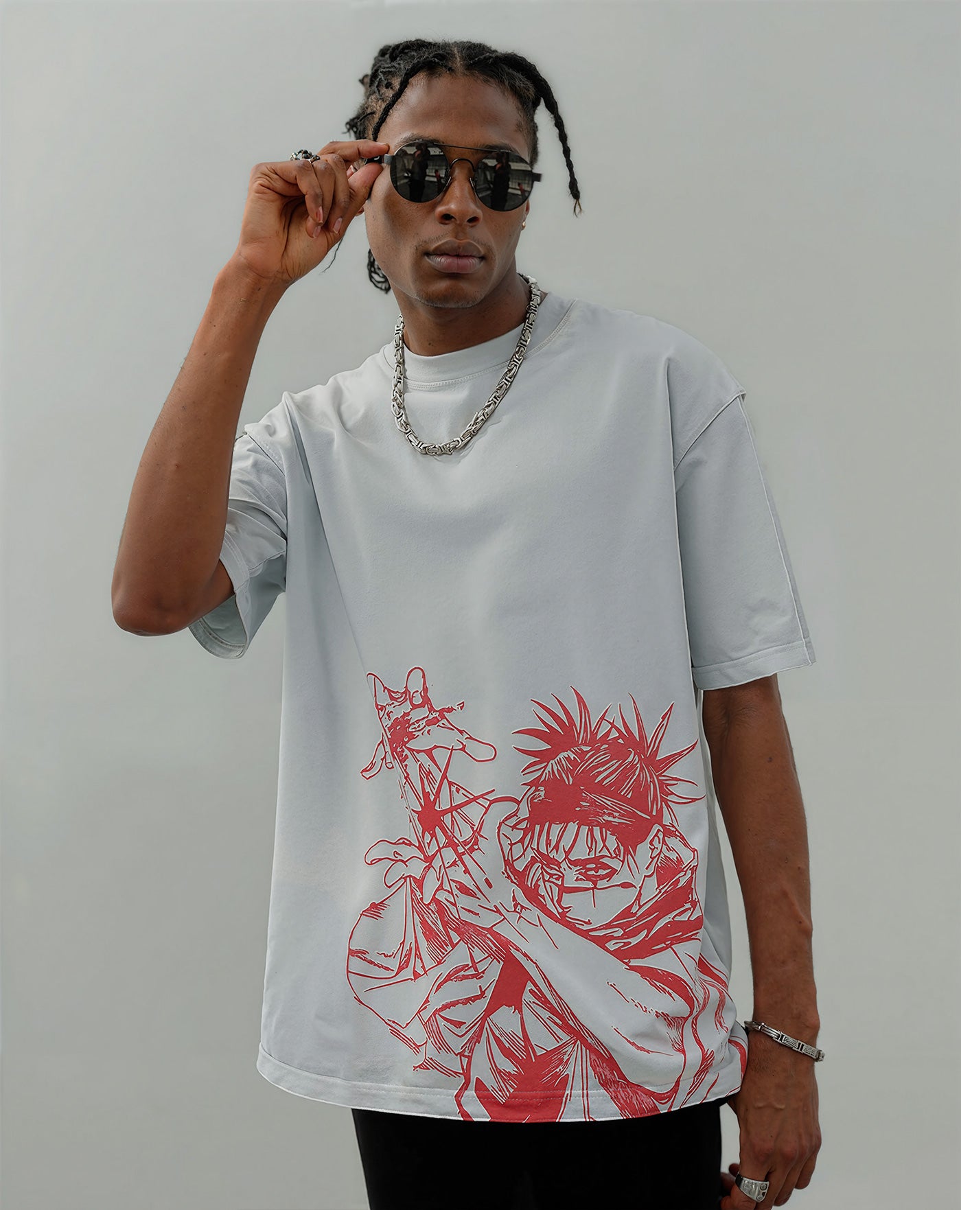 Man wearing a light grey anime-inspired streetwear t-shirt with bold red front graphic design, relaxed oversized fit from Torazen’s Piercing Blood 2-Sided Vintage Tee.