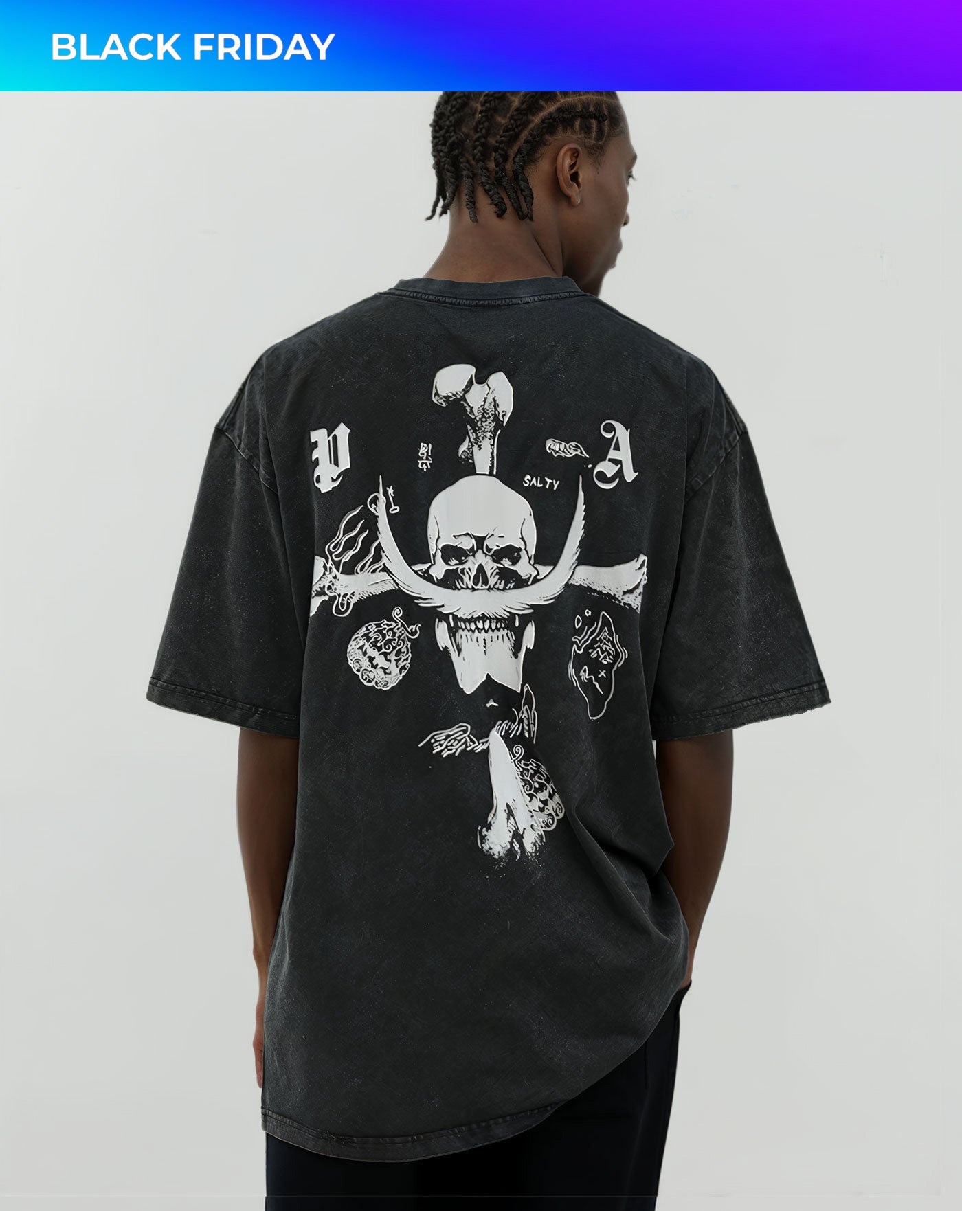 Man wearing a vintage washed black anime-inspired streetwear t-shirt featuring a bold skull and crossbone design, relaxed oversized fit from Torazen’s Whitebeard Pirates Legacy tee.